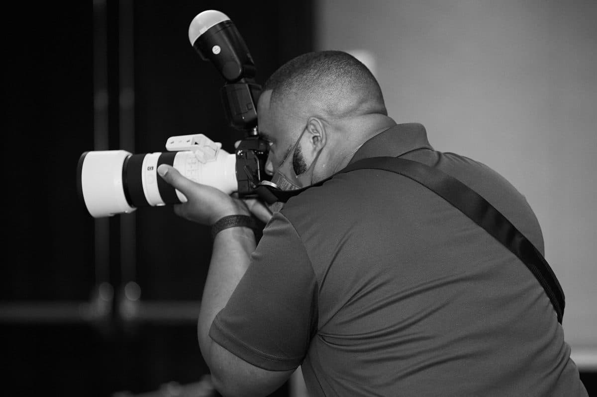 Sean Evans with camera at work